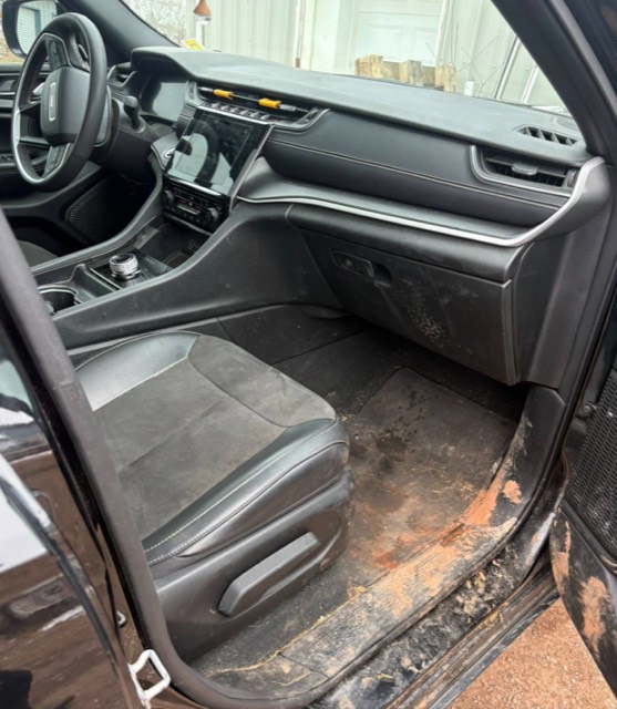Car interior before detailing, dirty floor and seats
