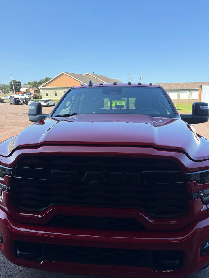 Front grille of the red 2026 Ram 2500, detailed by MG Detailing